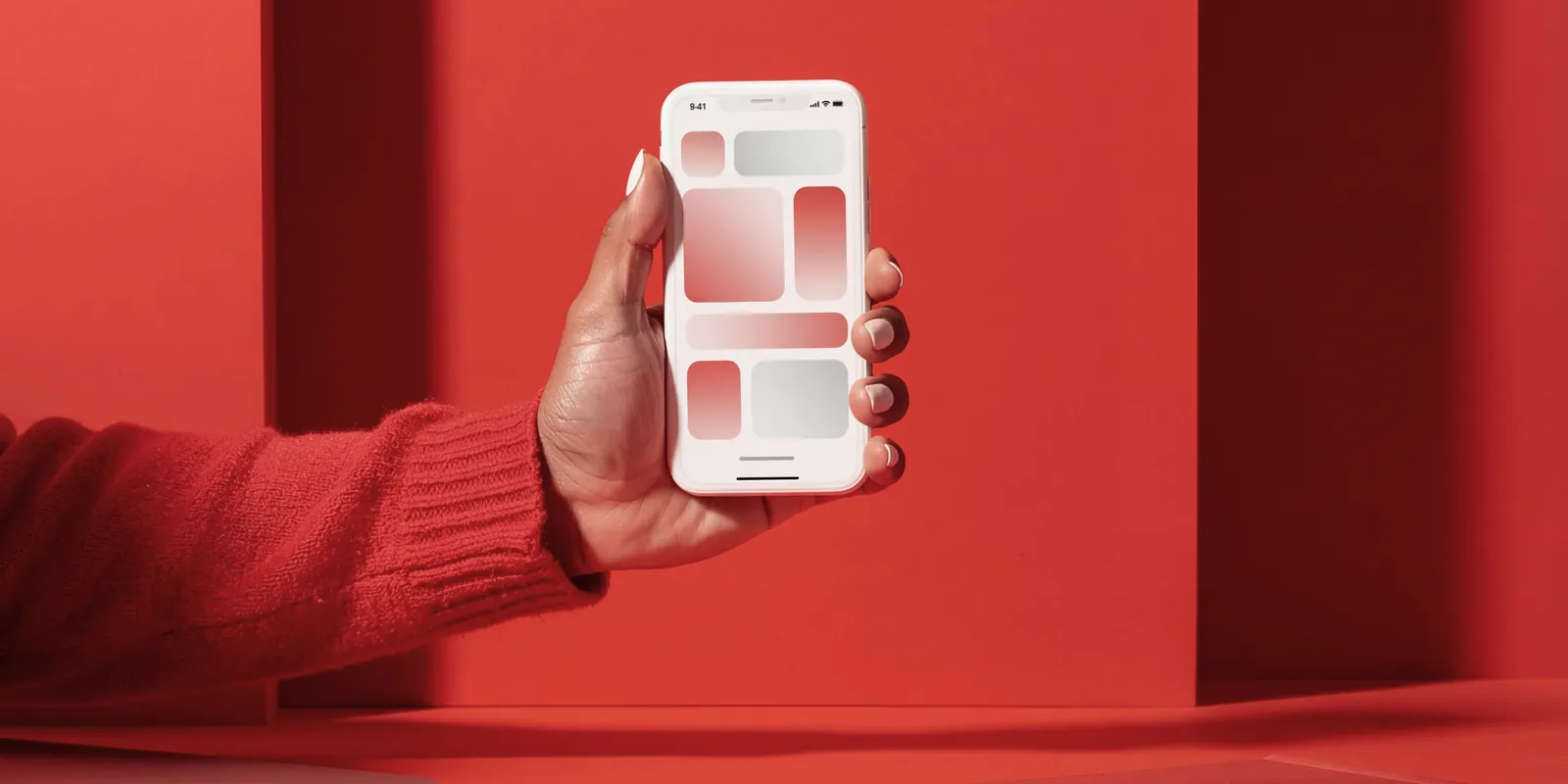 A person holding a mobile design mockup